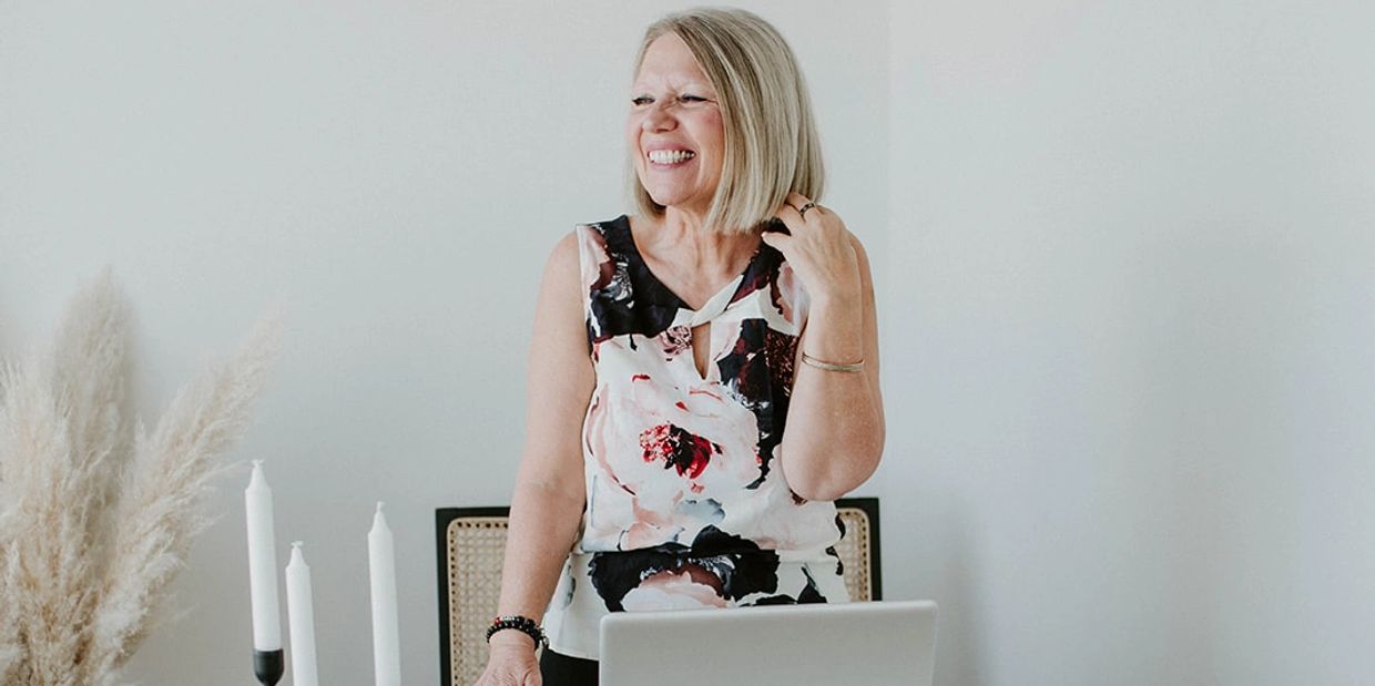 A woman 40+ experiencing emotional trauma healing & spiritual wellness through The GLOW~ Soul Method