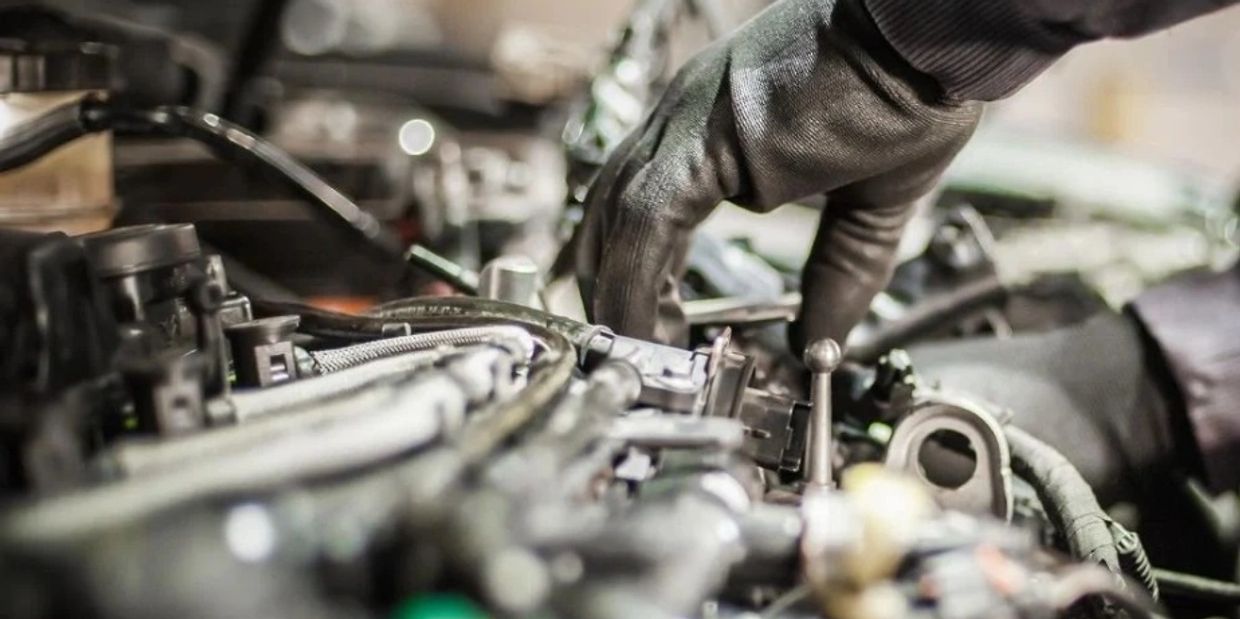 Mechanic working on an truck engine.