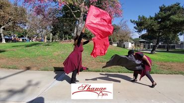 Shanae Arts recording "Jesus" at a park. Worship with flags section. 