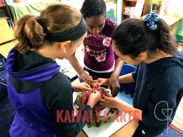 three girl students make something