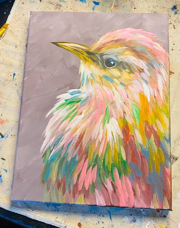 Colorful painting of a bird with vibrant feathers on a muted background.