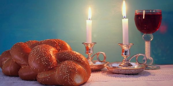 Shabbat candles, challah and wine for Kiddush