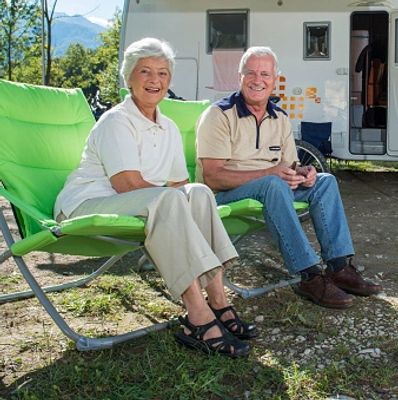 A couple traveling by RV and enjoying the outdoors.