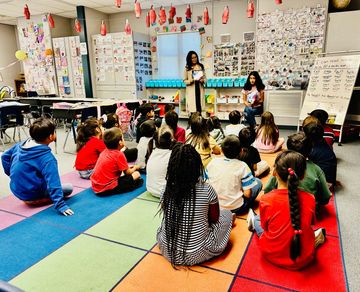 First graders engrossed in Skye+Fam storytime!