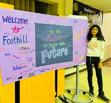 Skyler Farasat of Skye+Fam welcomed with a big, signed banner at Foothill Elementary School in CA 