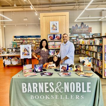 Young guest posing with Skye+Fam at Book Signing event in Barnes & Noble