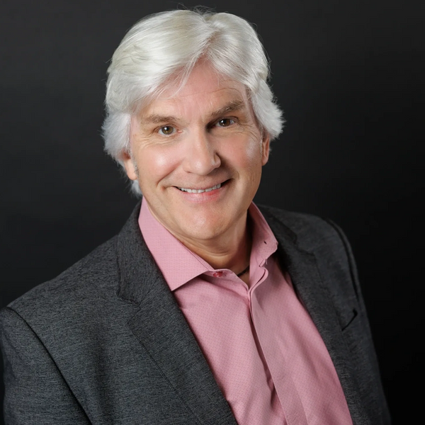 Professional image of Tom Olsen, expert in government relations and media training, smiling.
