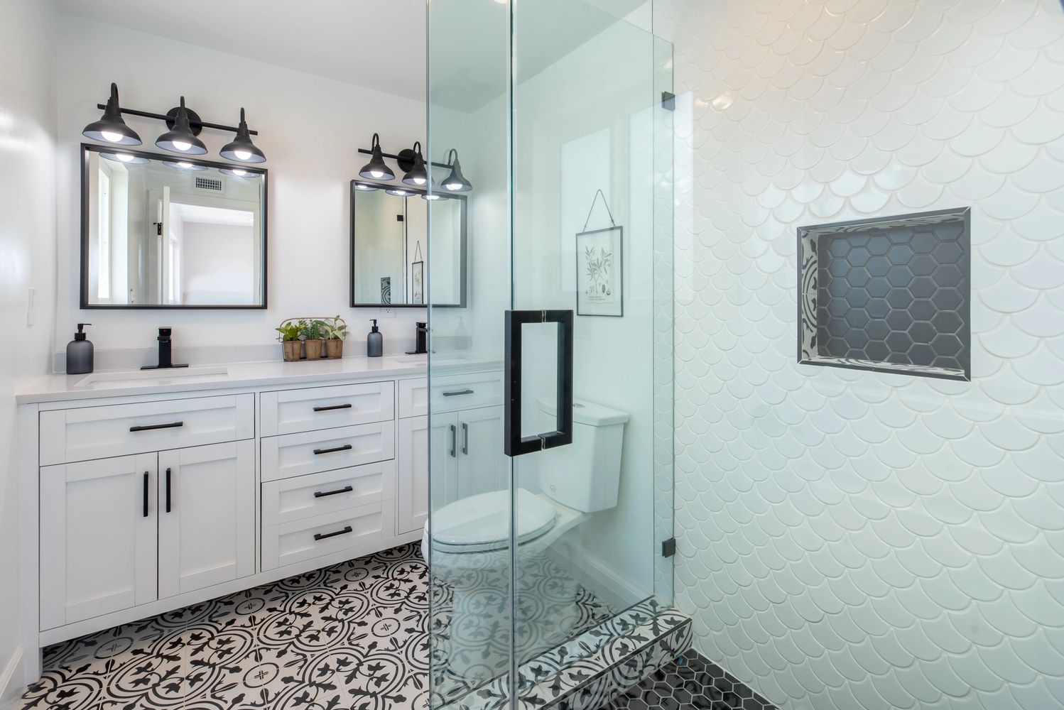 Remolded bathroom, black and white.