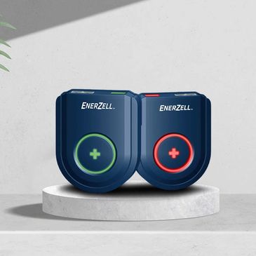Enerzell branded blue battery terminals with green and red indicators.