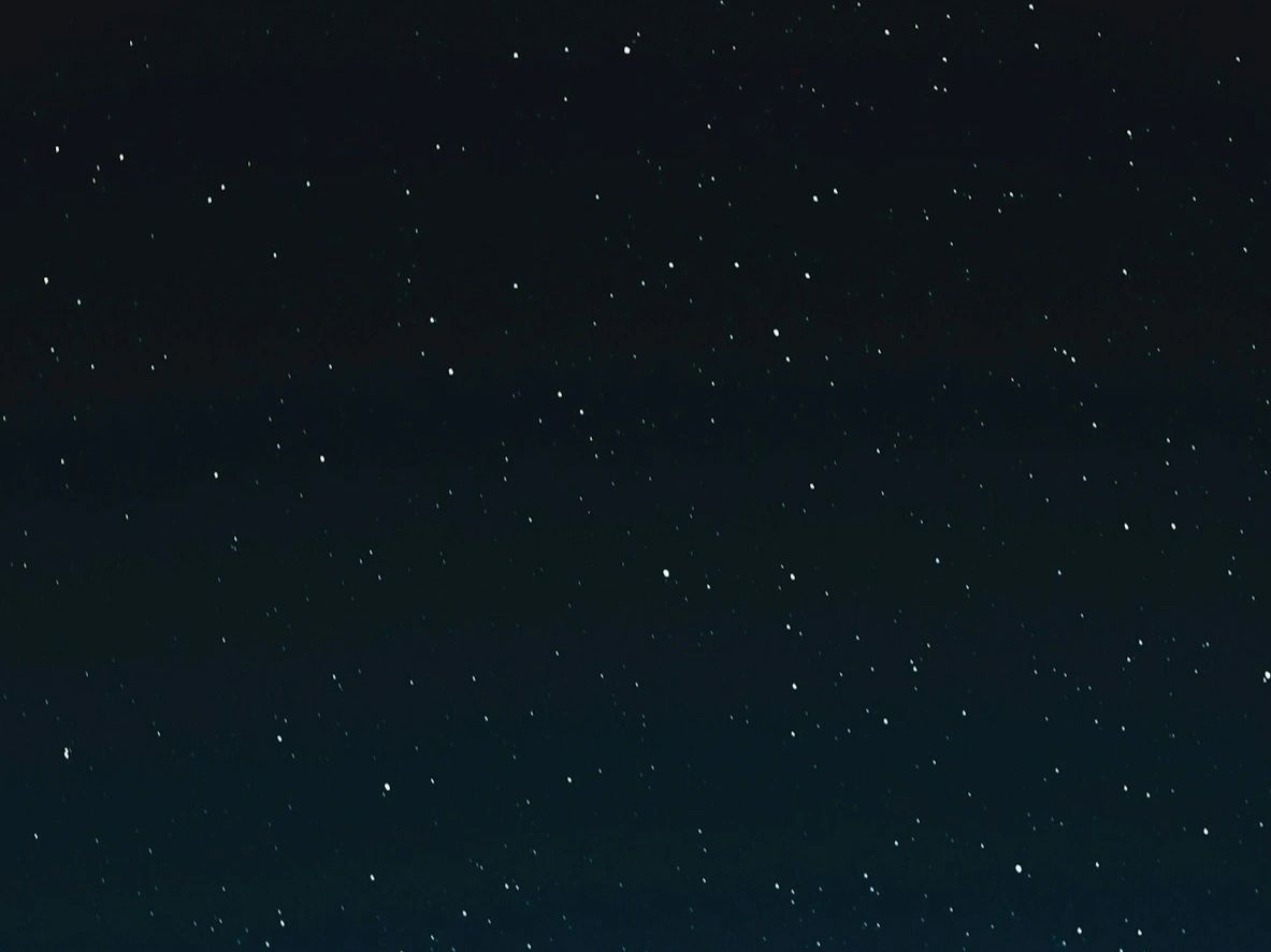 Clear night sky filled with numerous bright stars.