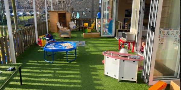 The Preschool outside decking area, in the sunshine.