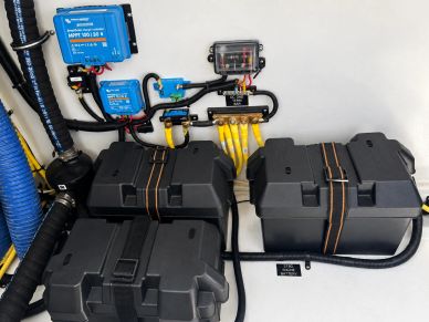 Battery setup with wiring and control units.