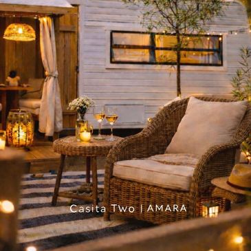 Cozy outdoor seating with warm lighting at Casita Two Amara.
