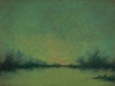 A peaceful green landscape at dusk.