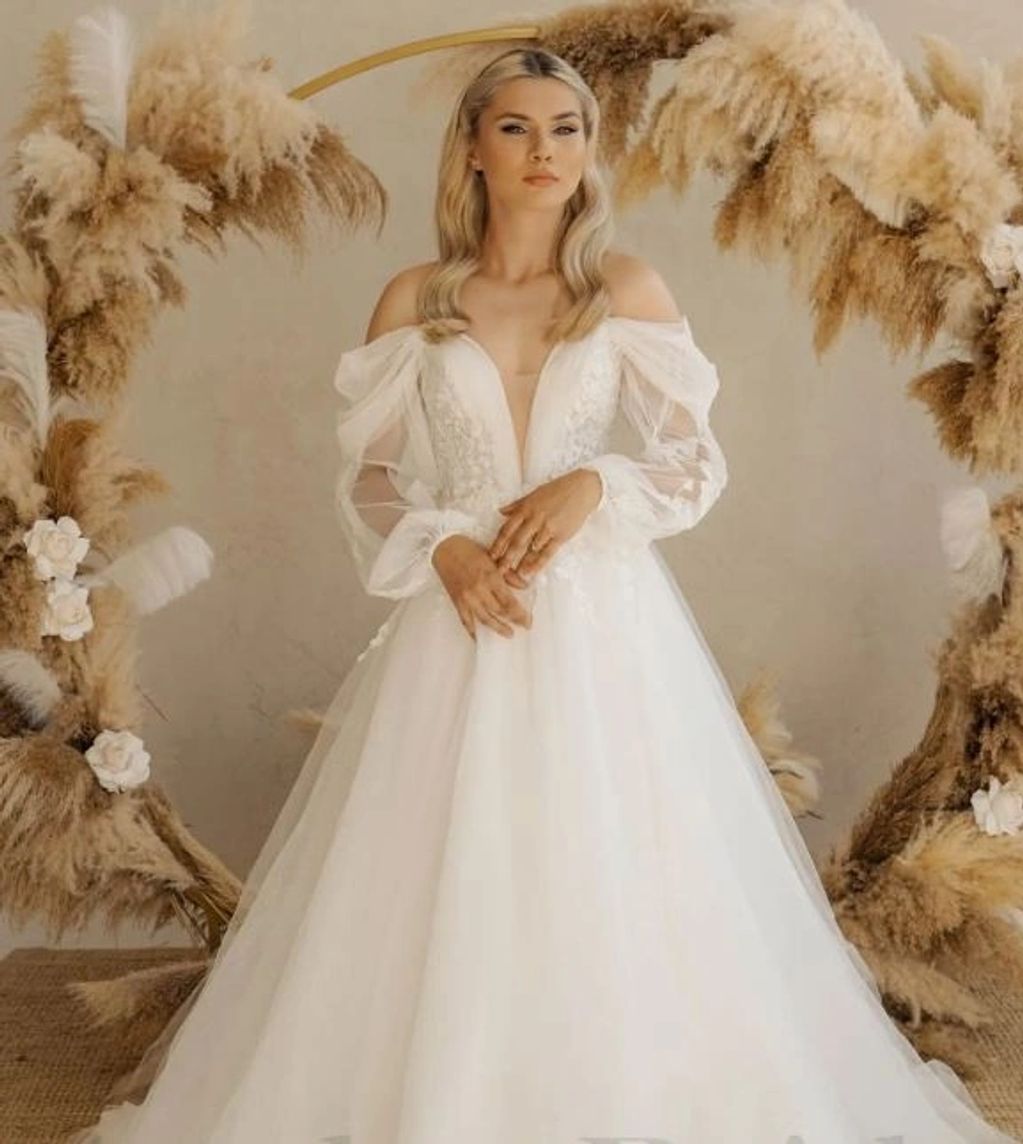 Boho A Line Floral Wedding Dress with Long Puffy Sleeves
$699.00