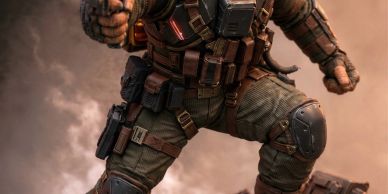 Soldier in tactical gear crouching.