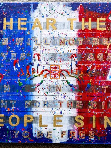 Colorful graffiti with a heart and text on a red, white, and blue background.