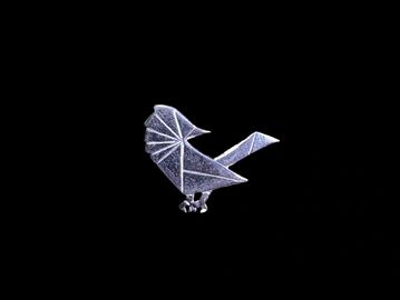 Minimalist origami-style bird against black background.