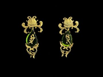 Intricate gold and green antique earrings.