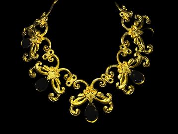 Elegant gold necklace with black teardrop gems.