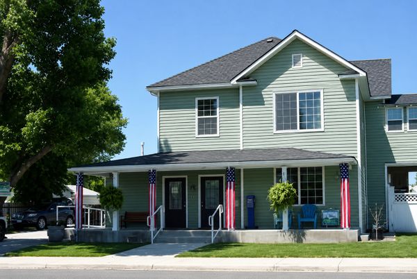 Green two-story residential house.