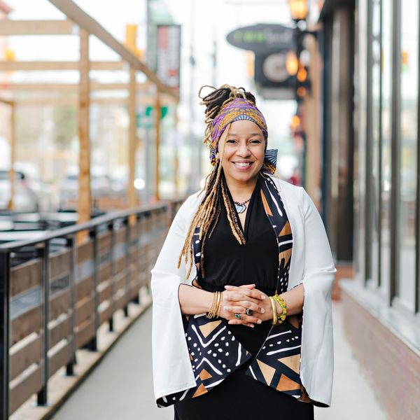 Dr. Lindo standing outside smiling at you. 