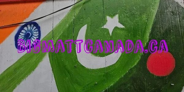 Graffiti of Indian and Pakistani flags side by side with website text.