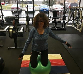 75 year old client and friend (Carol) showing excellent core strength and balance on a Swiss Ball