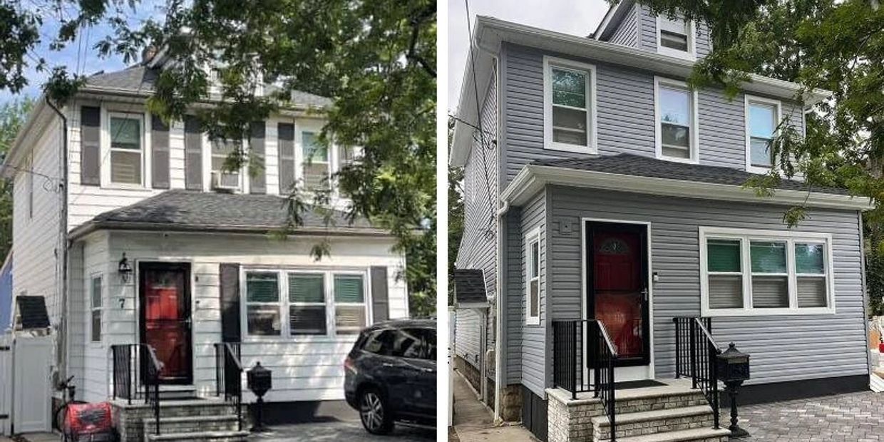 Two houses with red doors, one white and one grey, with trees around.