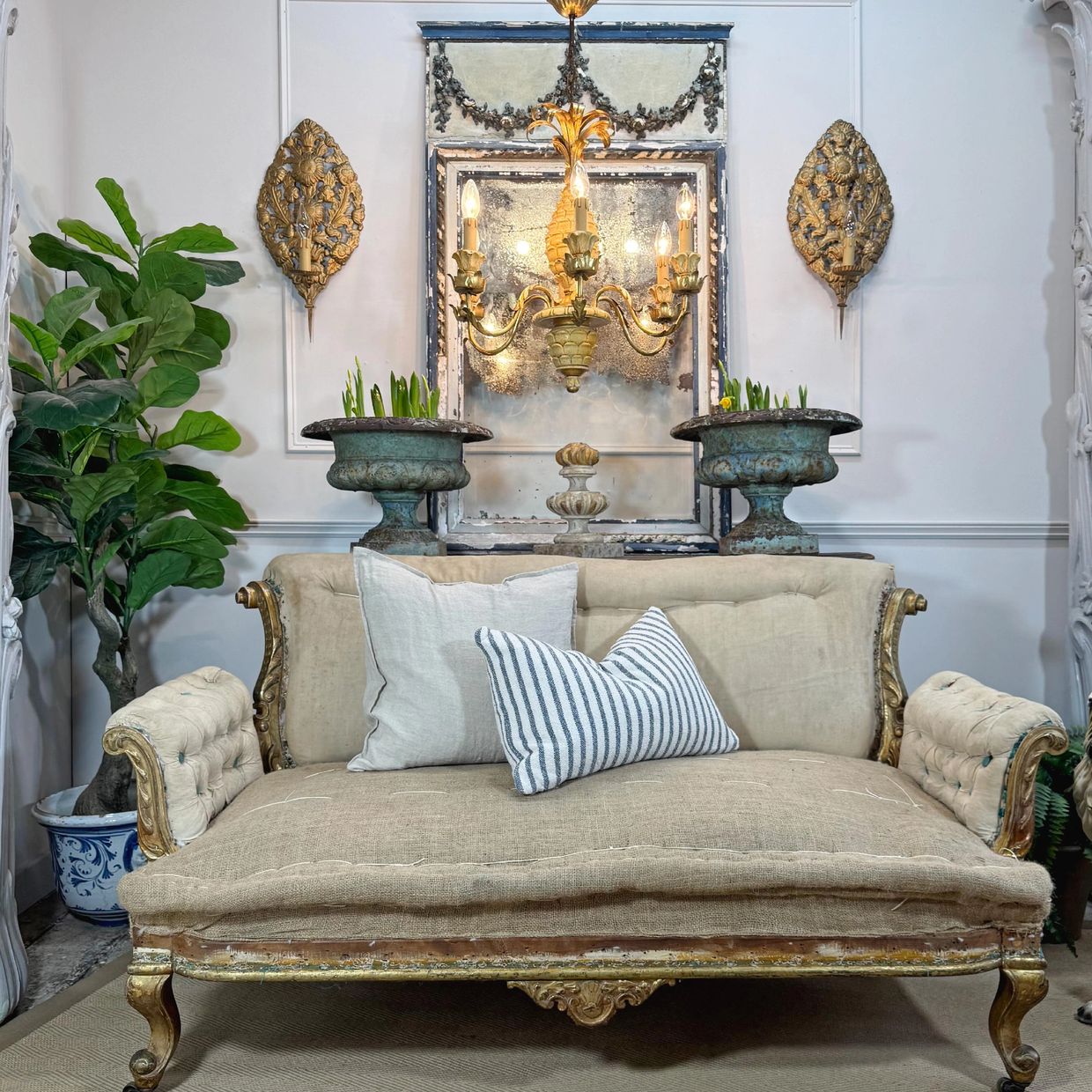 Napoleon III Rococo Revival Giltwood Settee with heavily foxed French Mirror, antique garden urns an