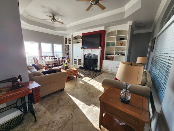 Living room w/fireplace and lake view