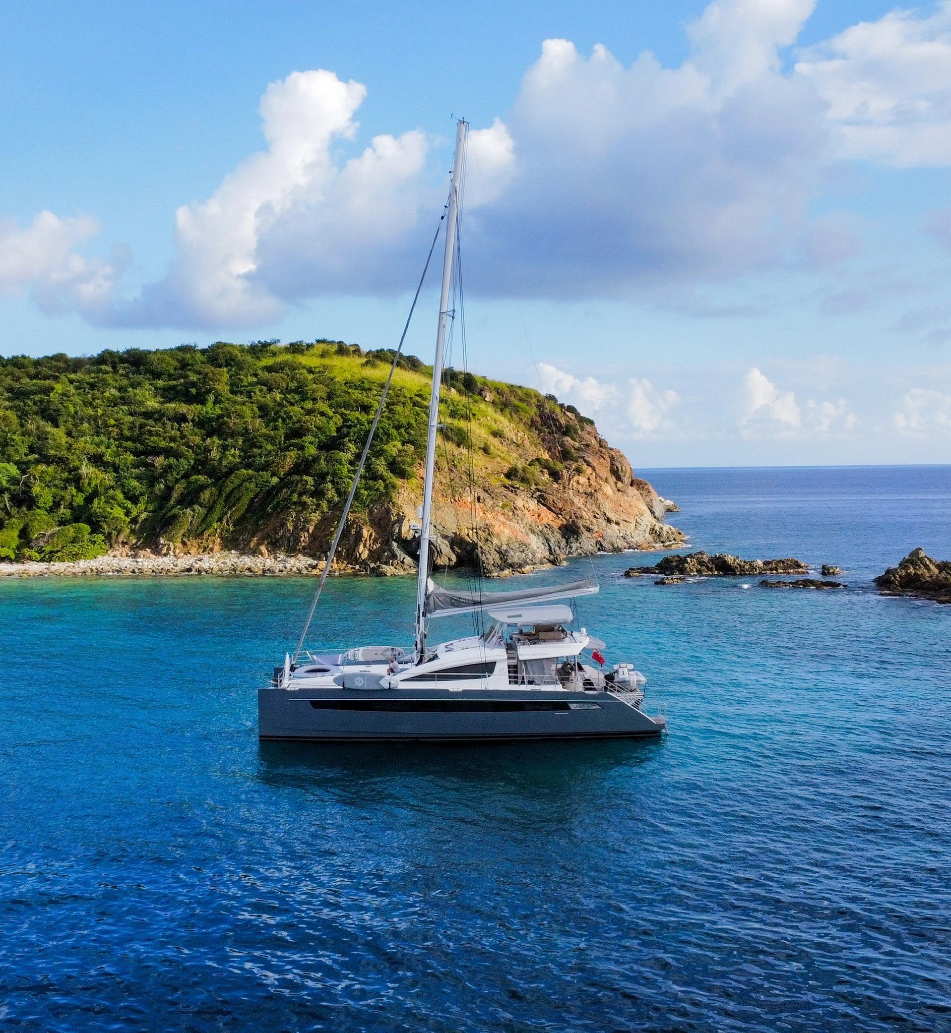 Luxury sailing catamaran Allure anchored in the Caribbean