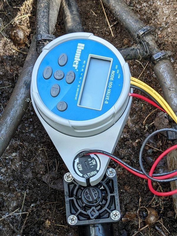 A Hunter Node irrigation battery operated irrigation controller with solenoid valve installed.