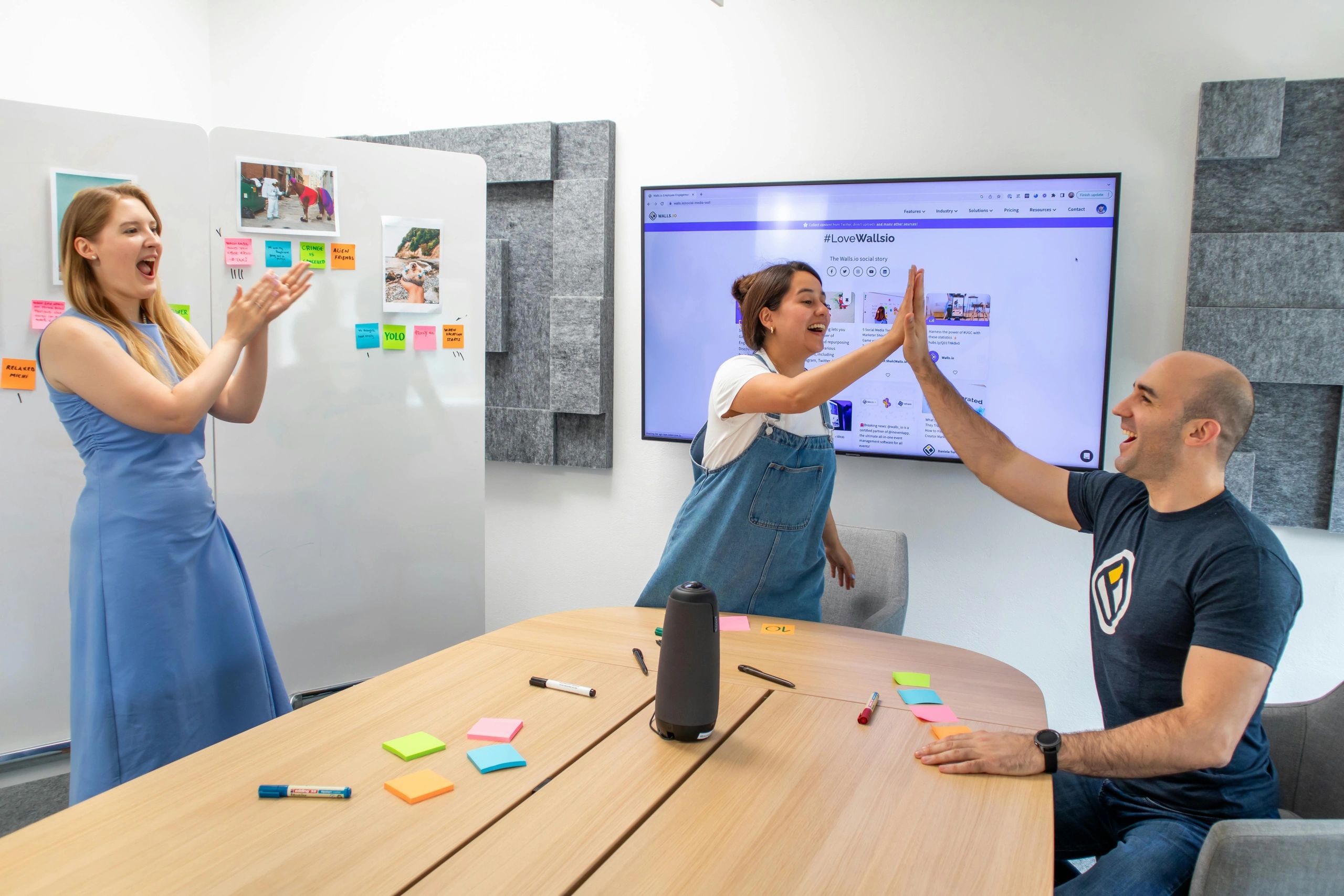 colleagues high-fiving each other