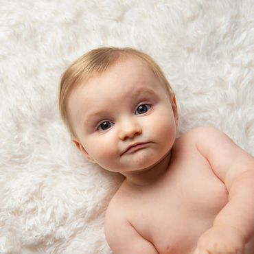 Headshot of baby boy during his milestone photography session in Austin, Texas. 