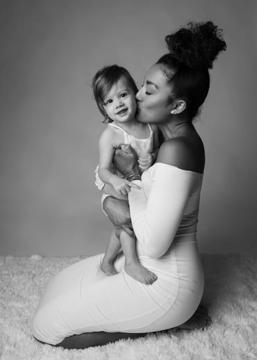 Black and white photo of Mom holding her baby during a photo session in Austin, Texas. 
