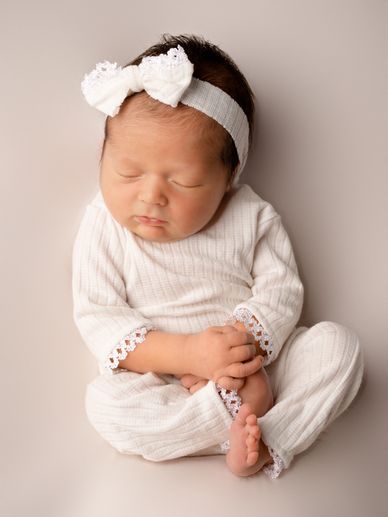 Baby girl sleeps during studio newborn photography session in Austin, Texas. 