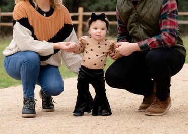 Couple pose with daughter for their outdoor family photoshoot in Austin. 