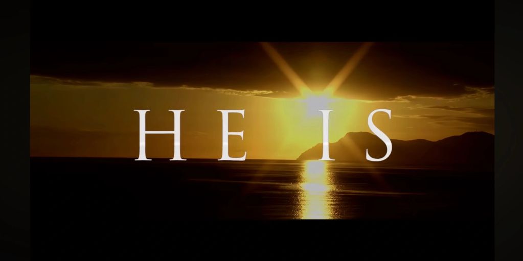 Sunset with the words 'HE IS' overlaid.