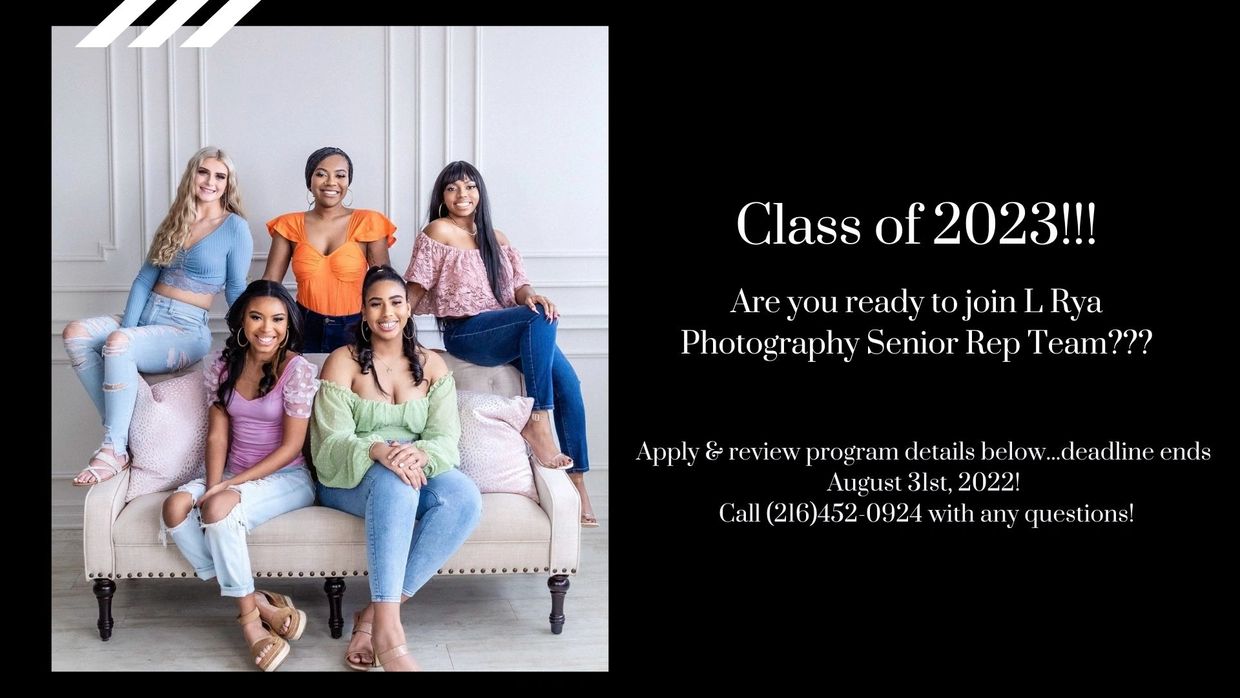 Group of senior girls dressed in spring colors smiling and sitting on a couch at Lake Arts Studio.
