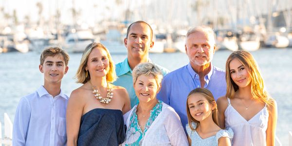 Candid lifestyle family photography in Point Loma with boats and water in the background. 