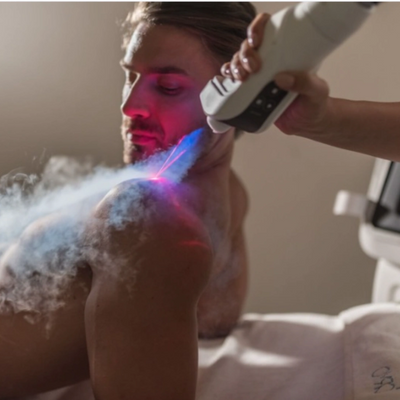 Man receiving cryotherapy on shoulder with cooling spray for orthopedic injuries and pain management