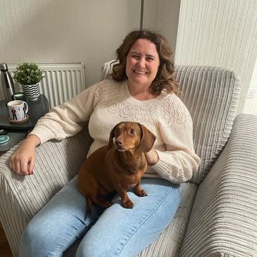 Dog sitter with sausage dog