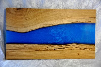 Image shows our blue river board.