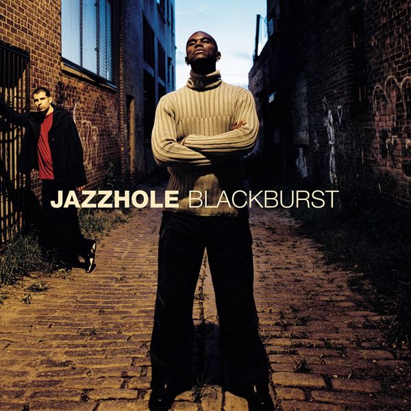 Two men posing in a narrow alleyway with text JAZZHOLE BLACKBURST.