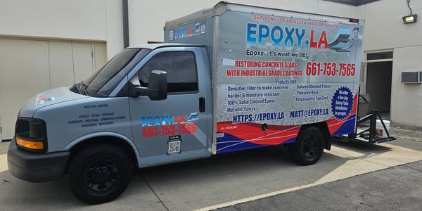 Blue epoxy service truck with detailed contact and service information.
