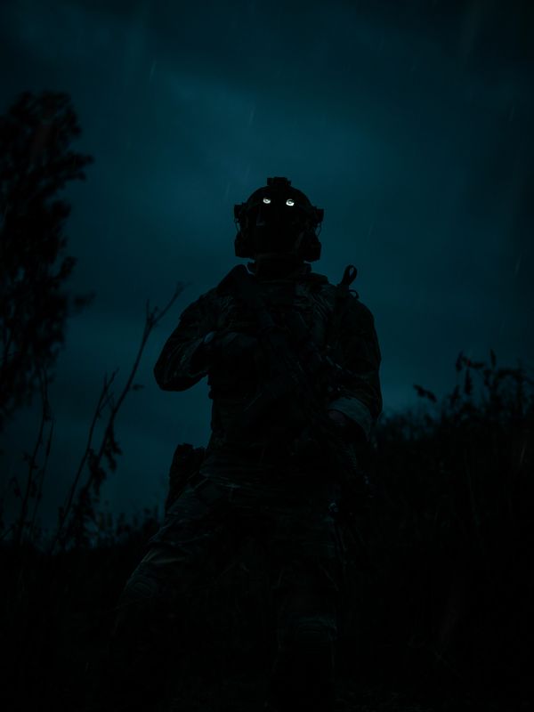 operator special forces with night vision mission escape kit