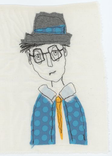 textile art of man in a suit wearing a hat and glasses