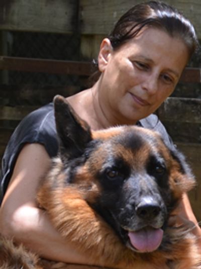 A picture of Marcela Aguilar with her dog Wolf