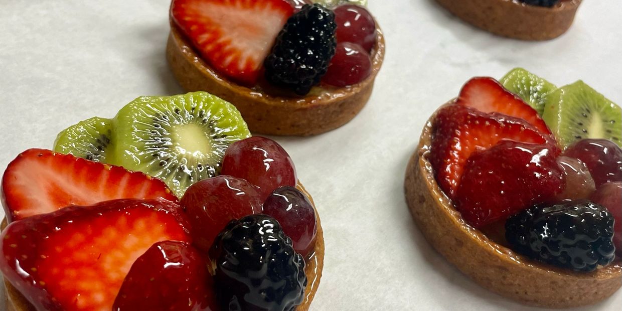 Glazed lemon tarts with fresh fruit